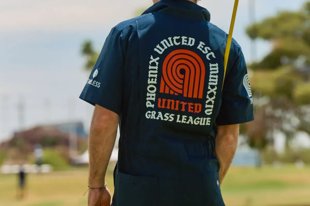 Back of a Phoenix United Esc. MMXXIV crewneck on the course